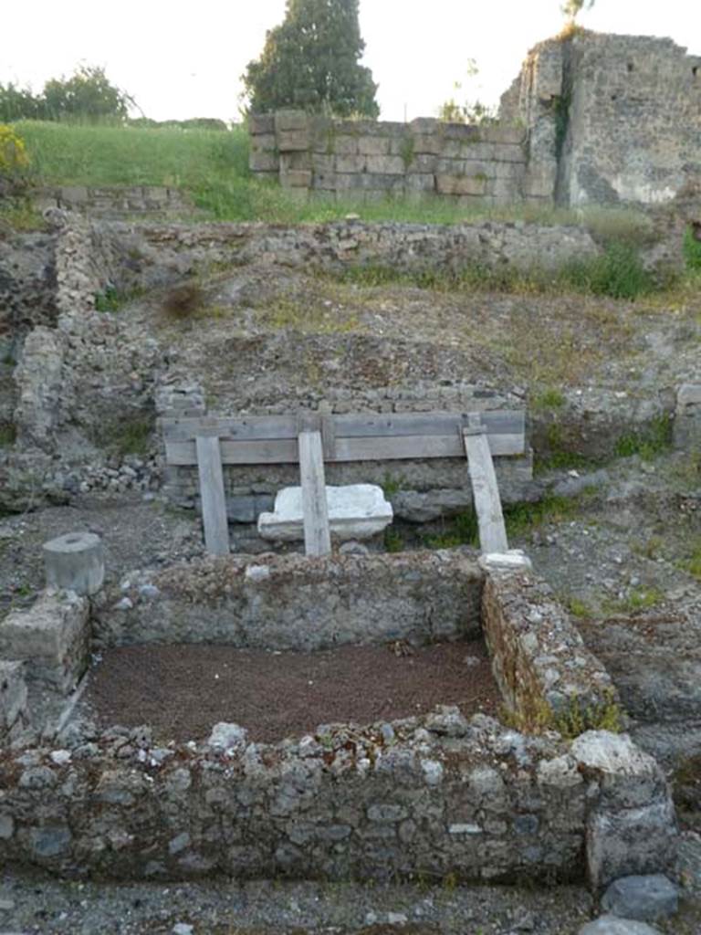 VI.2.19 Pompeii. May 2011. Looking north across the impluvium towards Tower XII, and the City walls.