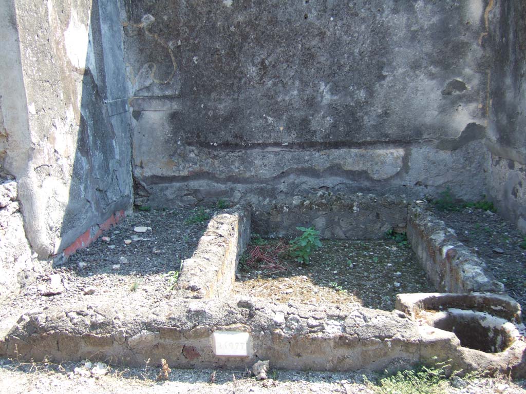 VI.2.26 Pompeii. September 2005. Looking south in yard area, towards area of small garden in centre, with basins and cistern.
According to Jashemski, this small garden in the rear south-west corner of the dwelling, was enclosed by a passageway on the east and south.
In the east wall was a window from the nearby enclosed triclinium, on the left (not yet photographed).
See Jashemski, W. F., 1993. The Gardens of Pompeii, Volume II: Appendices. New York: Caratzas. (p.123)