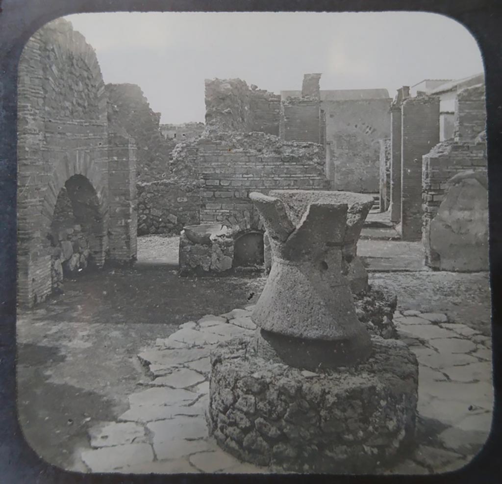 VI.3.3 Pompeii. c.1900. C. and G. Lantern slide published by A. Laverne. Room 7, looking west across bakery.