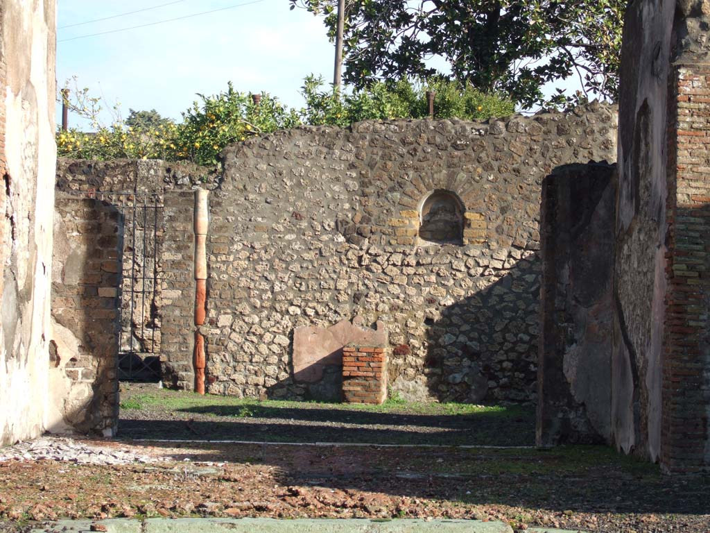 VI.3.7 Pompeii. December 2005. Looking east towards remains of masonry altar and niche in the garden area.
According to Boyce, the niche was undecorated, but the altar was coated with red stucco.
Behind the altar was a rectangle of white stucco, which served as a background for the Lararium painting.
See Boyce G. K., 1937. Corpus of the Lararia of Pompeii. Rome: MAAR 14. (p.45, and pl.12,2 and 4)
See Giacobello, F., 2008. Larari Pompeiani: Iconografia e culto dei Lari in ambito domestico. Milano: LED Edizioni. (p.172)