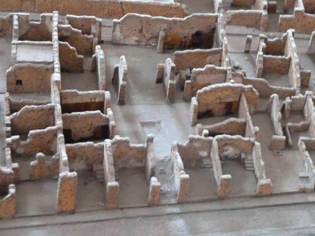 VI.3.7 Pompeii. May 2010. In the centre of the picture is a view, looking east from entrance corridor. From model in Naples Archaeological Museum. According to Helbig, paintings found in the big room on the right from the garden (room in south-east corner on model above) were – Dido & Aeneas, (Helbig 1381) and Dido mourning, (Helbig 1381b)
See Helbig, W., 1868. Wandgemälde der vom Vesuv verschütteten Städte Campaniens. Leipzig: Breitkopf und Härtel. According to Fiorelli, the paintings found were the prophecy of Cassandra, and the abandonment of Dido. See Pappalardo, U., 2001. La Descrizione di Pompei per Giuseppe Fiorelli (1875). Napoli: Massa Editore. (p.52). According to Breton, the house was discovered in January 1806 and was given its name by the number of painted musical instruments found on the atrium walls. On the right (south) of the atrium were two rooms (according to Fiorelli, “the atrium was bordered by four cubicula” presumably two on either side) then instead of an ala an open room with a bath, having at the rear a baptisterium in which one descended by two steps, as one has seen in the Baths, but here it was in stone, paved with bricks and covered in stucco. (According to Fiorelli “ and an ala where others have recognised a bath, but to me it seems footings for a wooden cupboard”) To the left was a large triclinium. The tablinum was placed between two corridors and entirely open, front to back. The peristyle was small, having a portico on the side near the tablinum, which was supported by a masonry pillar. In the corridor on the right of the tablinum was the entry to the kitchen. This corridor lead directly into an oecus, where some paintings were still conserved - Dido learning of the departure of Aeneas and, nearly vanished, a religious scene. At the back of the peristyle one saw a small altar discovered 24th March 1810, surmounted by the two serpents and a painting of the genius making a libation. This painting had nearly vanished. See Breton, Ernest. 1870. Pompeia, Guide de visite a Pompei, 3rd ed. Paris, Guerin. Photos taken from the rear entrance, of the rear rooms can be seen at VI.3.25 and VI.3.26.