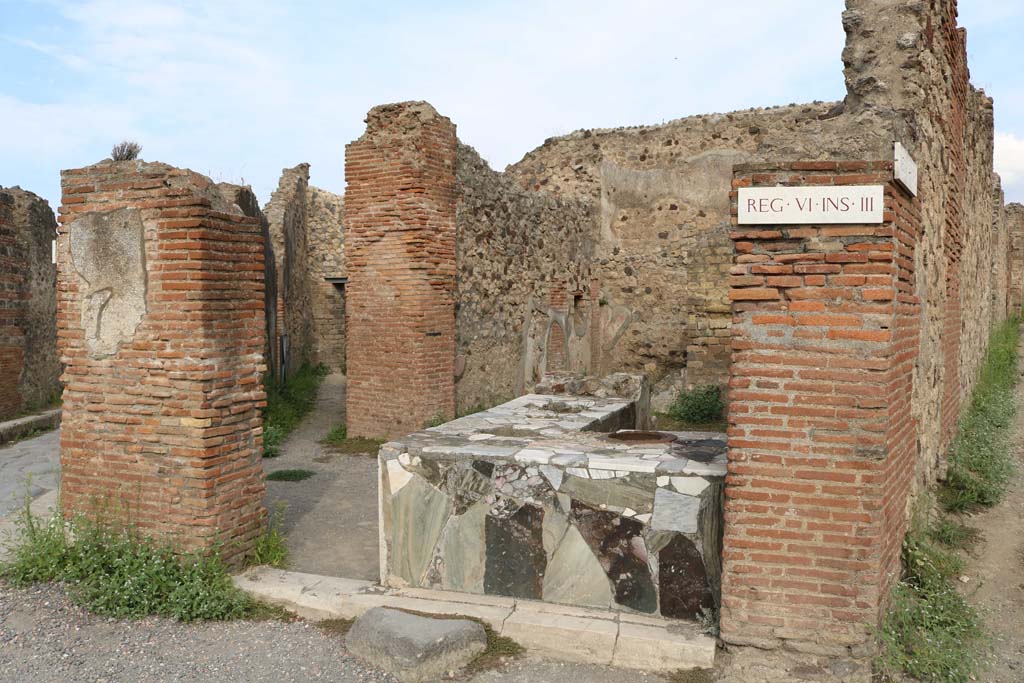 VI.3.20/1918 Pompeii. December 2018.
Looking north-west from VI.3.20. across VI.3.19 towards doorway/corridor into VI.3.18. Photo courtesy of Aude Durand.