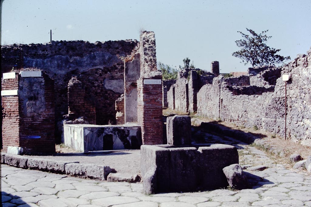 VI.3.20 Pompeii. 1968.
Looking north towards bar in Via Consolare and fountain at junction with Vicolo di Modesto. Photo by Stanley A. Jashemski.
Source: The Wilhelmina and Stanley A. Jashemski archive in the University of Maryland Library, Special Collections (See collection page) and made available under the Creative Commons Attribution-Non Commercial License v.4. See Licence and use details.
J68f1644