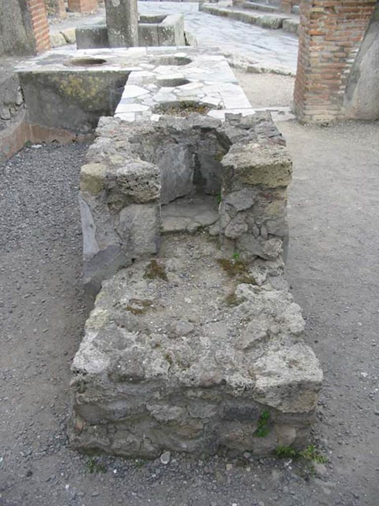 VI.3.20 Pompeii. May 2003. Looking south across hearth at rear of counter.
Photo courtesy of Nicolas Monteix.