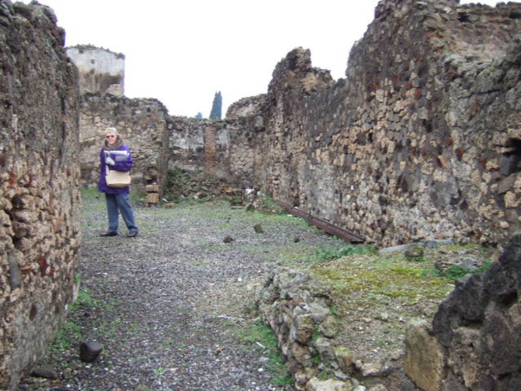 VI.4.10 Pompeii. December 2005. Looking north across atrium. The site of a room with the remains of a staircase can be seen on the east side of the entrance fauces