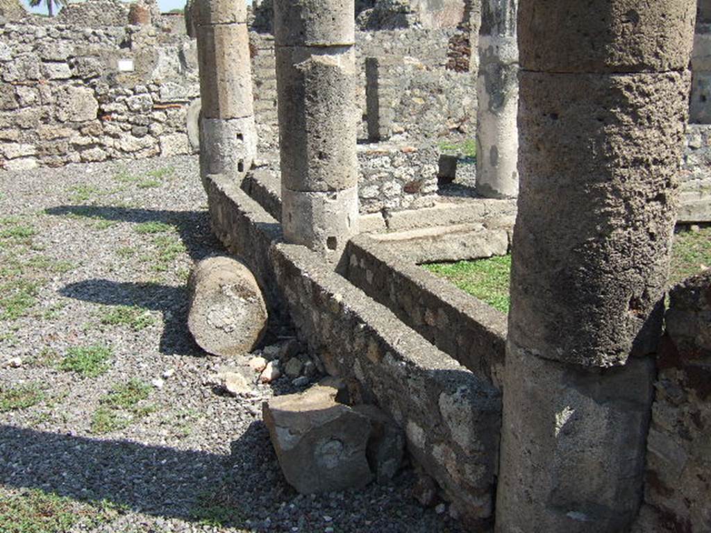 VI.5.10 Pompeii. September 2005. Room 1, north side of peristyle.
According to Jashemski, when excavated in 1809 the peristyle area was found in a ruined state. Today, the columns on the north and south are joined by a low wall which has a planting space on top. The low wall on the east side has been restored without a planting space. The entire house was found in such a ruined state it was nearly impossible to know how the rooms were connected. See Jashemski, W. F., 1993. The Gardens of Pompeii, Volume II: Appendices. New York: Caratzas. (p.126)