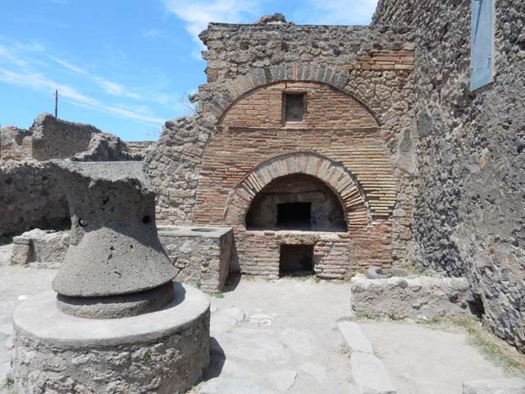 VI.6.17 Pompeii. May 2017. Looking towards oven in bakery. The bin sunk into the floor was found near the east wall, on the right. Photo courtesy of Buzz Ferebee.