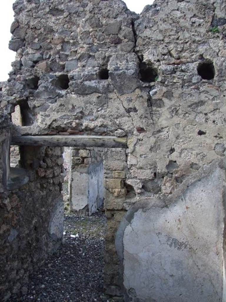 VI.7.1 Pompeii. March 2009. North wall of small room or storeroom with door. According to Fiorelli, the walls of this small room were used to keep accounts graffiti written with the stylus. There were also two vents to make the room better ventilated.
See Pappalardo, U., 2001. La Descrizione di Pompei per Giuseppe Fiorelli (1875). Napoli: Massa Editore. (p.57)