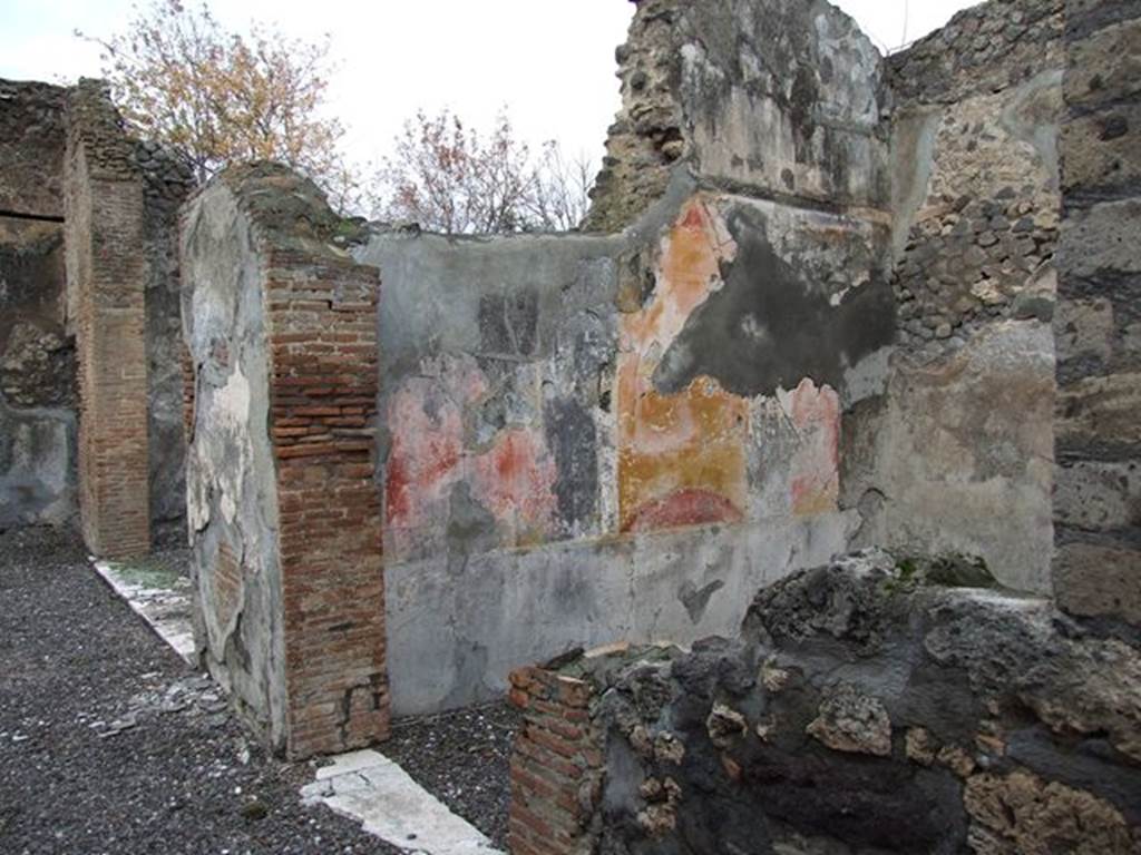VI.7.20 Pompeii. December 2006. Looking west along north portico of peristyle towards doorway to triclinium, on left, and west wall and doorway to small oecus.
