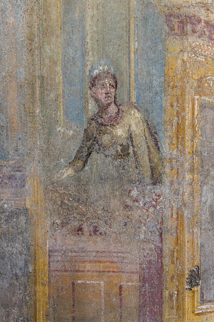 VI.7.23 Pompeii. October 2023.
Cubiculum, detail of female figure on a balcony from north wall. Photo courtesy of Johannes Eber.
