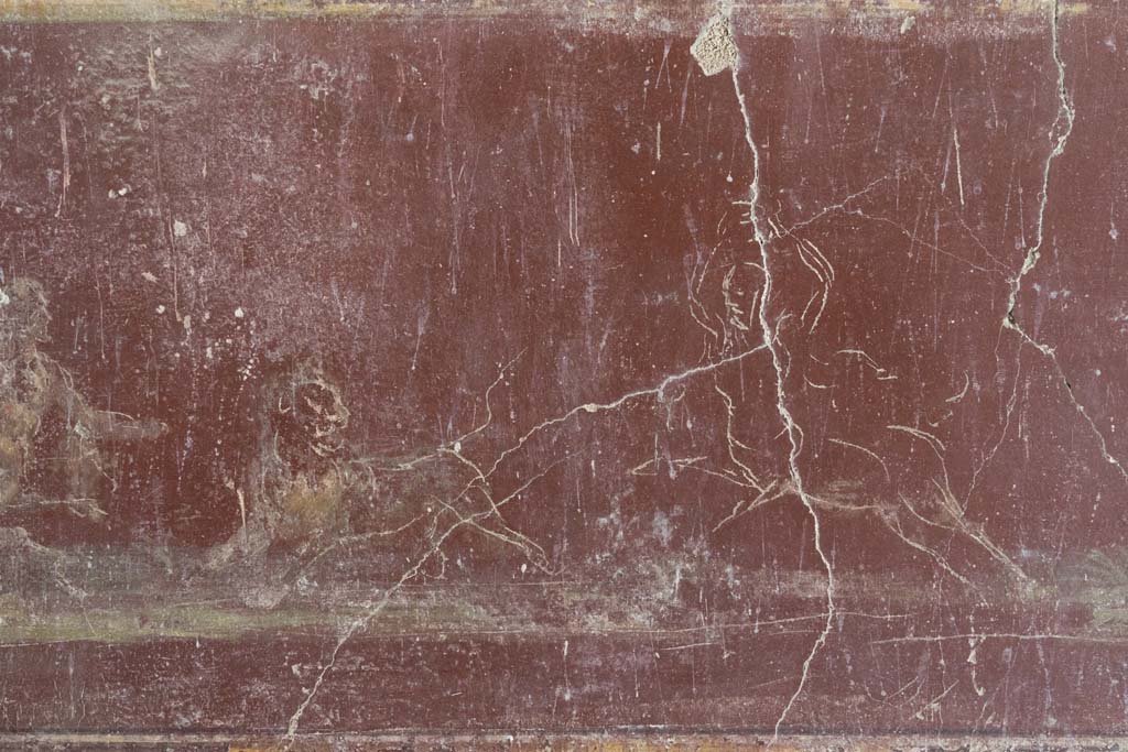 VI.8.3/5 Pompeii. April 2022.
Room 12, detail of continuation of part of hunt scene with centaurs and a lion, from red predella below central panel on south wall.
Photo courtesy of Johannes Eber.