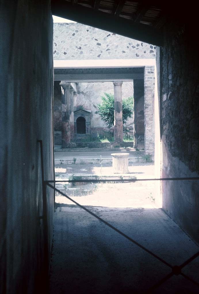 VI.8.5 Pompeii. August 1965.
Looking north along fauces, across atrium to tablinum and peristyle, at rear. Photo courtesy of Rick Bauer.