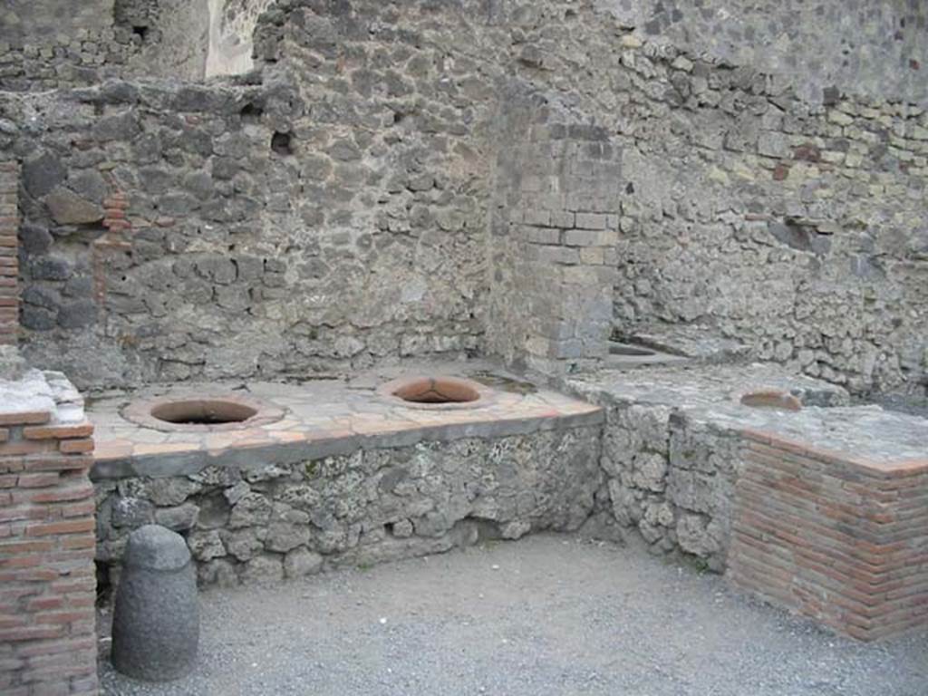VI.8.8. Pompeii. May 2003. Looking towards two dolia on west side at northern end of counter. Photo courtesy of Nicolas Monteix