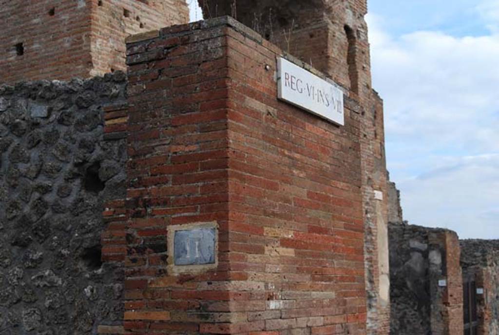 VI.8.11 Pompeii. November 2009. Pilaster on east side of entrance doorway. Photo courtesy of Nicolas Monteix.