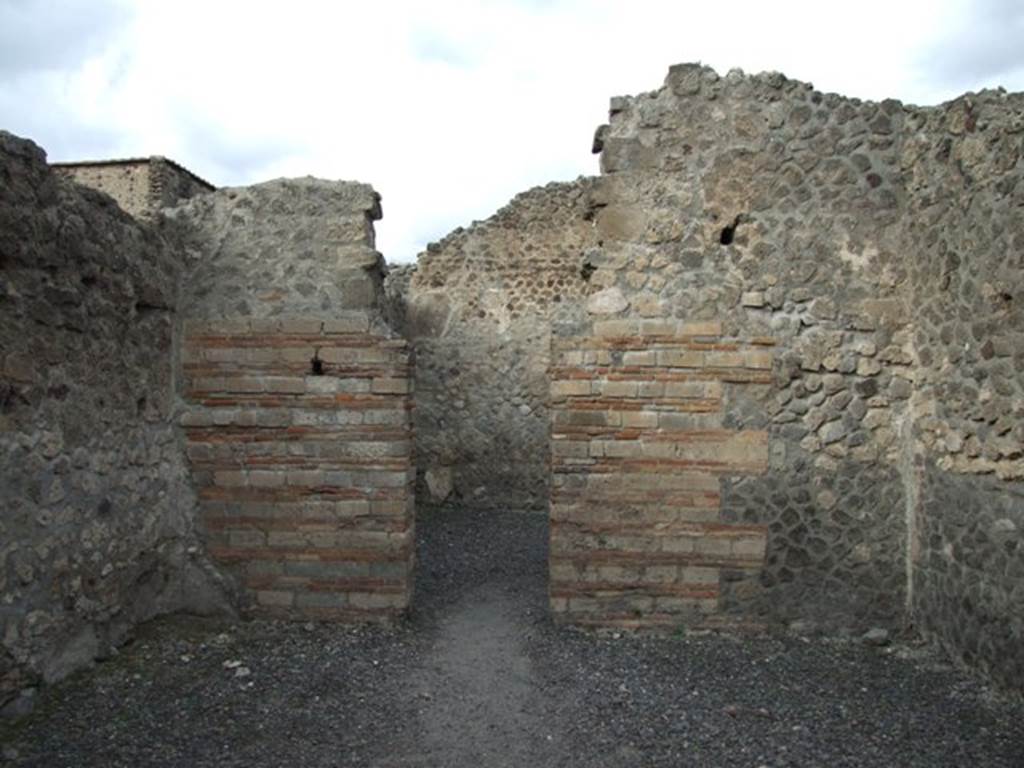 VI.8.11 Pompeii. Shop. December 2007. North wall with door to rear room.
