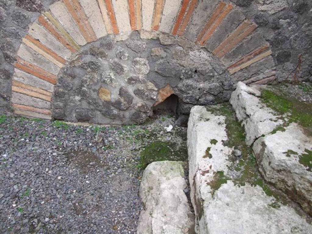 VI.8.11 Pompeii. Shop. December 2007. Remains of steps to upper floor in rear room.