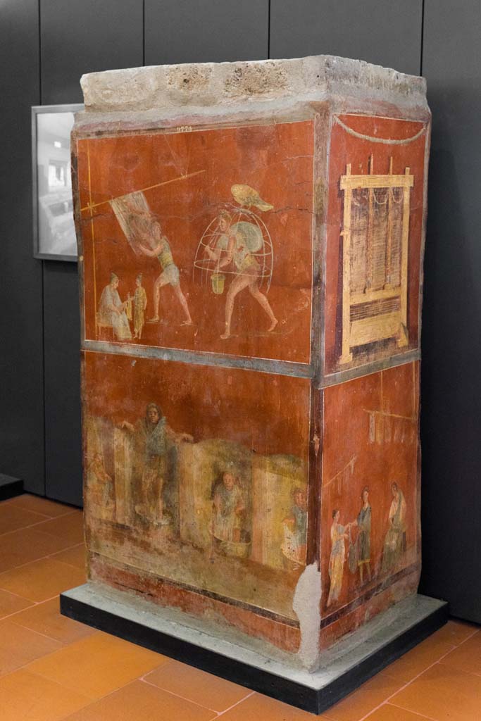 VI.8.20 Pompeii. July 2021.
Looking towards front and side of pillar with fullonica scenes. Photo courtesy of Johannes Eber.
Now in Naples Archaeological Museum. Inventory number 9974.