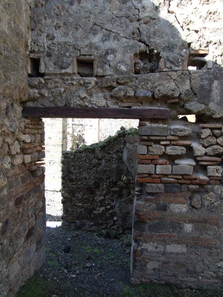 VI.8.20 Pompeii. March 2009. Doorway on north wall of kitchen area.