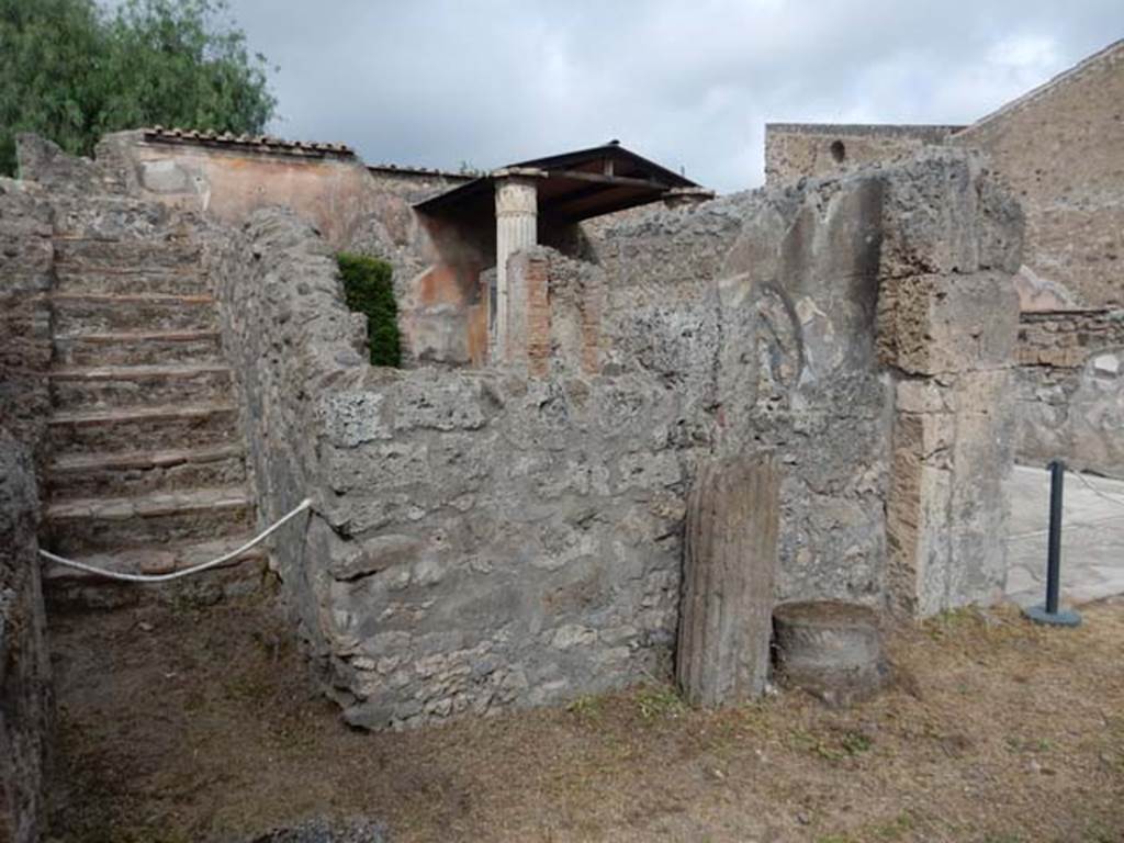 VI.8.22 Pompeii. May 2017. Stairs to upper floor and west wall of south ala, at the rear of which is the oecus. Photo courtesy of Buzz Ferebee.