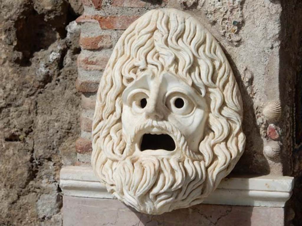 VI.8.22 Pompeii. May 2017. Hollow marble mask on south side of fountain, after restoration. Photo courtesy of Buzz Ferebee.