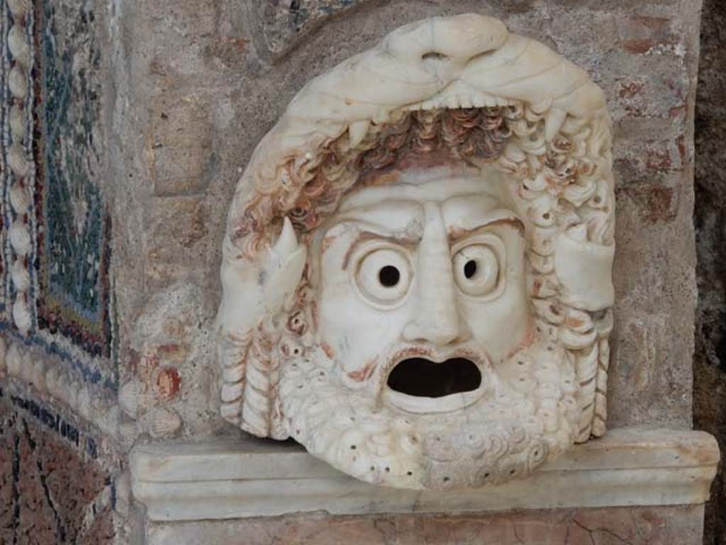 VI.8.22 Pompeii. May 2017. Hollow marble mask on north side of fountain, after restoration. Photo courtesy of Buzz Ferebee.