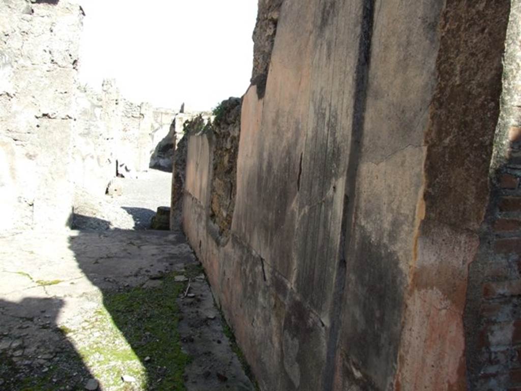 VI.8.22 Pompeii. March 2009. Room 12. Triclinium. Looking east along south wall towards door to atrium.