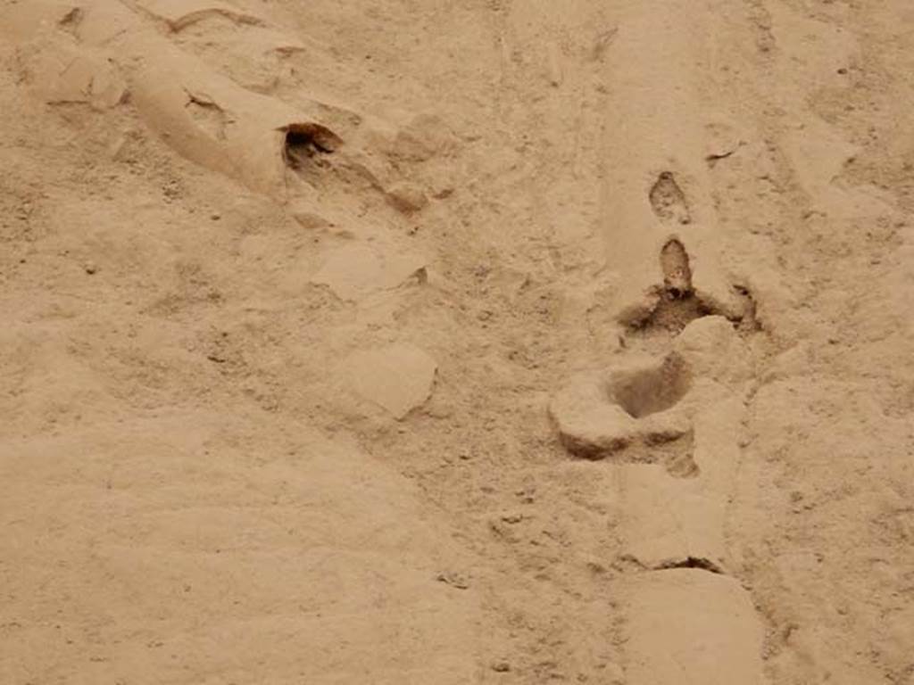 VI.8.23 Pompeii. May 2017. Detail of surface below garden area, and terracotta pipe leading from fountain. Photo courtesy of Buzz Ferebee.