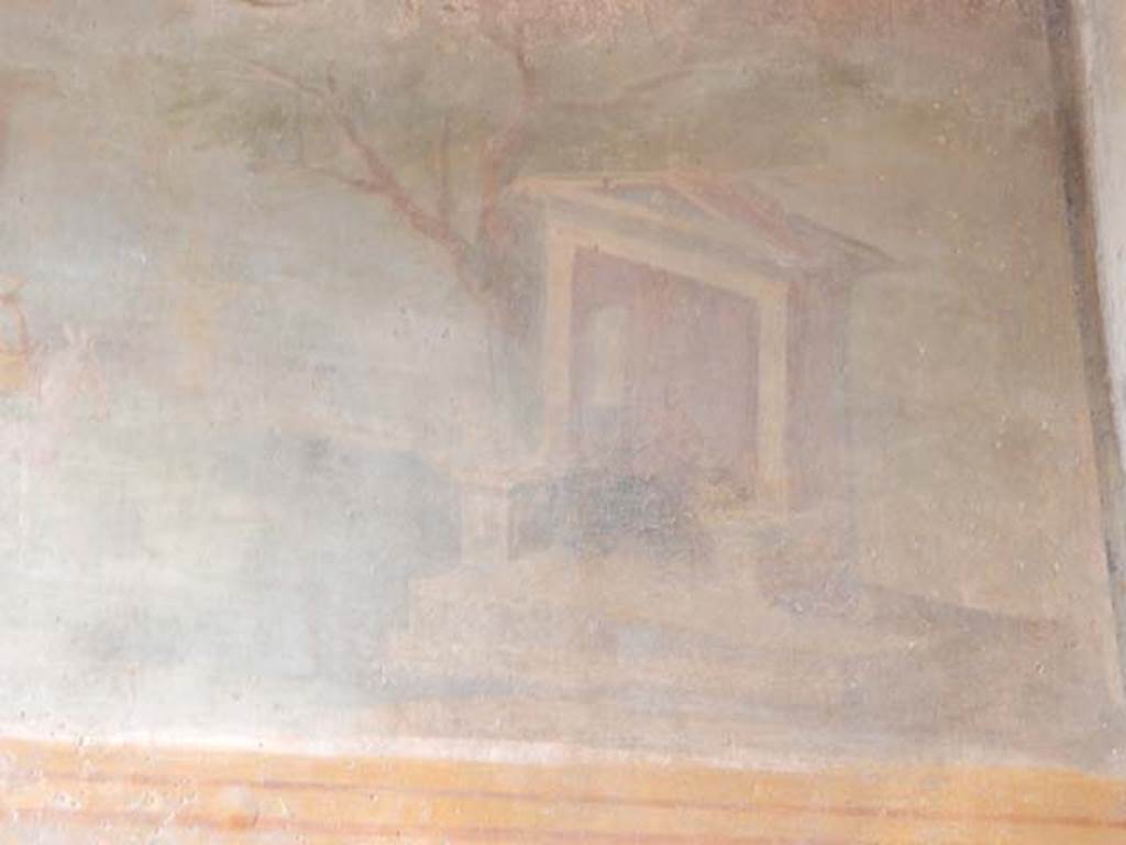 VI.8.23 Pompeii. May 2017. Detail of north end of sacred landscape showing a small temple next to a tree with a seated divinity. Photo courtesy of Buzz Ferebee.