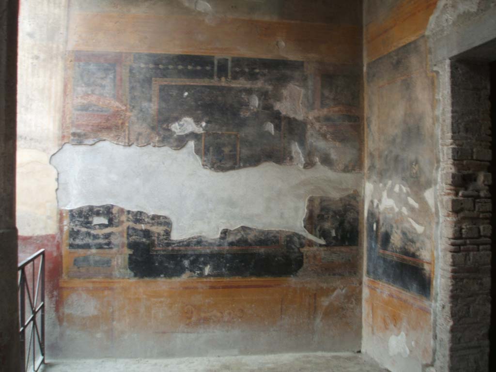 VI.8.23 Pompeii. May 2005. West wall at north end of garden, and north-west corner.
According to Jashemski there was a portico on the north and east side of the garden.
It was supported by four columns and two engaged columns.
See Jashemski, W. F., 1993. The Gardens of Pompeii, Volume II: Appendices. New York: Caratzas. (p.136)
The doorway, on the right, leads to one of two garden rooms.