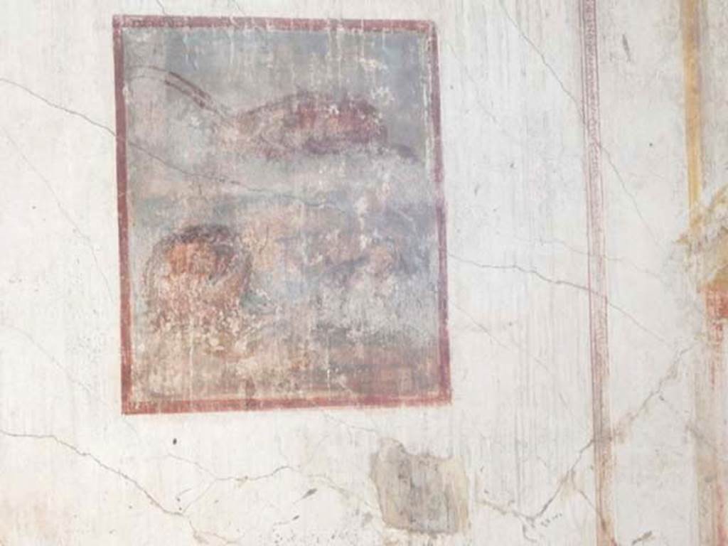 VI.8.24 Pompeii. May 2017. Detail of central painting from east wall of triclinium in south-east corner of atrium.
Photo courtesy of Buzz Ferebee.
The central painting was a still life which showed a fallen basket with a capsized fish on a podium, in the background was a lobster/crayfish.