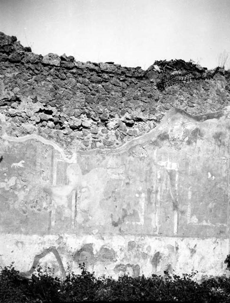 231497 Bestand-D-DAI-ROM-W.635.jpg
6.9.1 Pompeii. W635. Room 11, looking towards north wall with remains of wall decs.
Photo by Tatiana Warscher. With kind permission of DAI Rome, whose copyright it remains.
See http://arachne.uni-koeln.de/item/marbilderbestand/231497
According to Warscher, it was possible to measure exactly the divisions on the north wall.
1) side panel – 1,15; 2) architectural motive – 0,14;
3) central panel – 1,00; 4) architectural motive – 0,13;
5) side panel – 1,16.
On each side panel a panther was represented; on the central panel were two beasts but could not be indentified. The traces on the west and east wall showed that these were painted in the same manner as the north wall, but since these walls were longer the panels were proportionately wider or there were five panels. The measure showed that the central panel was 1,25m. This was a convenient place for a picture of 0.95 wide. I have minutely examined the border of the same painting, there are traces of yellow colour. We have therefore an indication that the painting had been taken from a yellow background. Bonucci called the house ‘House of Iside and Io”. This was a decisive argument, as Bonucci worked at Pompeii at the time of the excavation of the house in question. Moreover, it was possible that the painting may have been from another room in this house. The painting of Io was a long way from being one of the best paintings from Pompeii, but without doubt it was the best painting in the “Gabinianum”. Nothing prevents us from believing that in this room were the sacred banquets and the presence of the painting of Io in an unassuming tavern was a proof that the cult of Isis was widespread among the lower classes of Pompeii. It was not possible however to say definitely if the painting of Io was on the west wall or the east. Right in the centre of the west wall there is a hole, part of which goes all the way to the other side – to the east side of the ala. See the photographs.
See Warscher, T, 1938: Codex Topographicus Pompejanus, Regio VI, insula 9: Pars prima, (no.17, 17a), DAIR, Rome.
