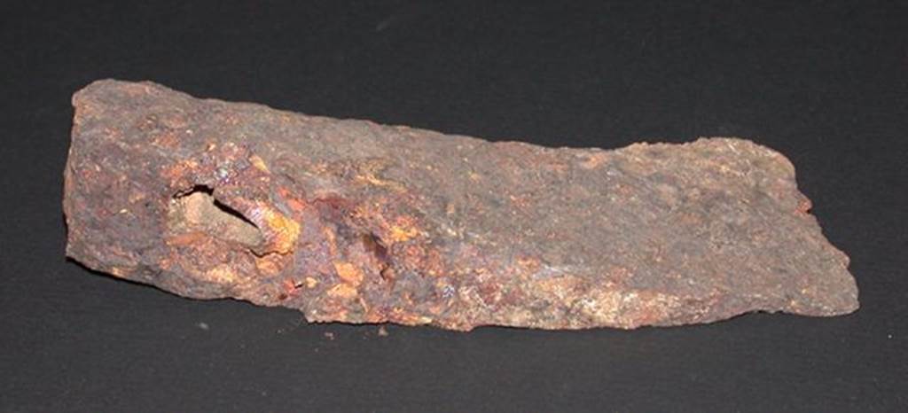 VI.9.1 Iron axe head, front view. Height 0.033m, width 0.057m, length 0.14m. OA 2811 Hache, musée Condé, photo RMN © R.G. Ojeda
