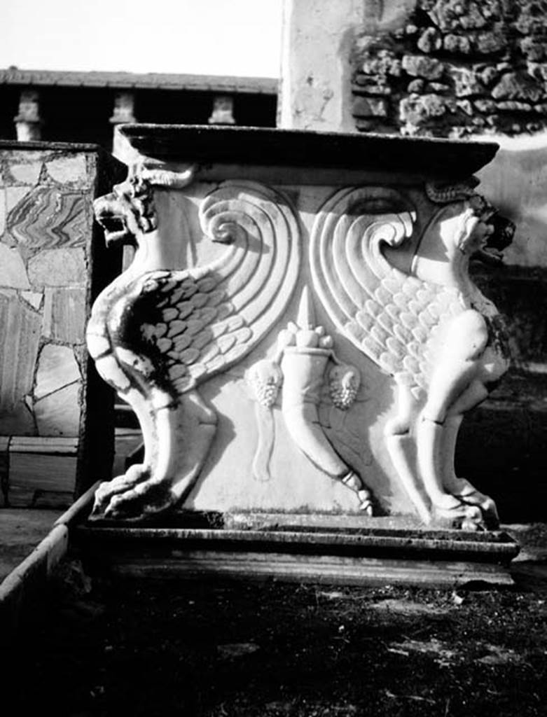 231956 Bestand-D-DAI-ROM-W.455.jpg
VI.9.2 Pompeii. W.455. Room 2, marble table leg 6 with pediment 5 in front.
Photo by Tatiana Warscher. With kind permission of DAI Rome, whose copyright it remains.
See http://arachne.uni-koeln.de/item/marbilderbestand/231956