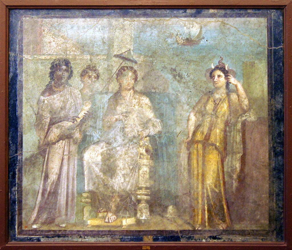 VI.9.2 Pompeii. Found 12th October 1829 in room 2, atrium. Wall painting of the abandoned Dido seated on a throne surrounded by maids.
Africa is recognisable by the elephant trunk and tusks. The ships of Aeneas are sailing away in the distance.
Now in Naples Archaeological Museum. Inventory number 8898.
Photo courtesy of Giuseppe Ciaramella taken December 2019.