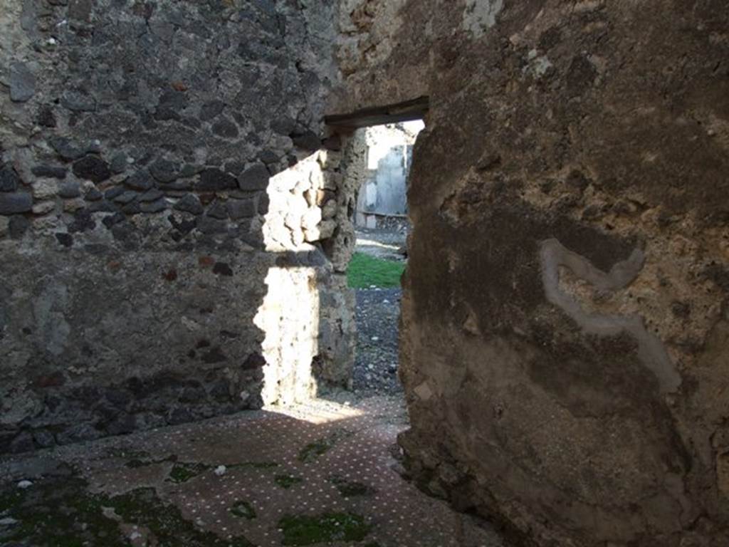 VI.9.4 Pompeii. December 2007. Room 15, looking towards south wall and doorway into fauces 14 and atrium 16 of VI.9.5, from entrance.