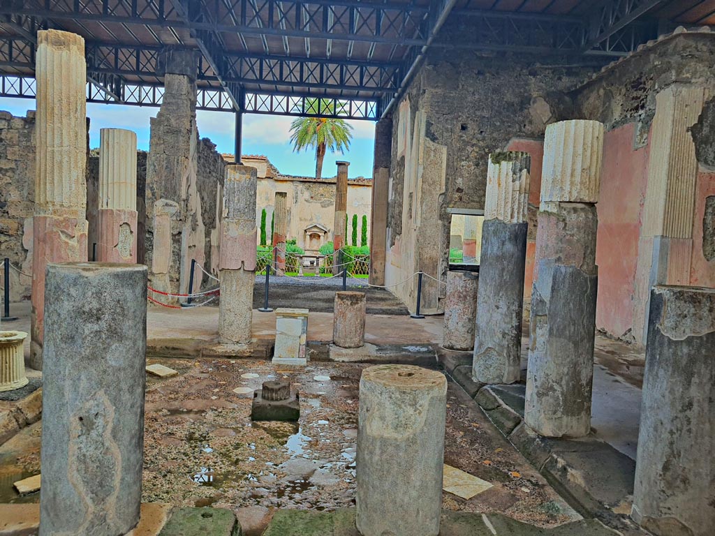 VI.9.6 Pompeii. November 2023.
Looking east towards tablinum and garden area, across south side of impluvium in atrium. Photo courtesy of Giuseppe Ciaramella.