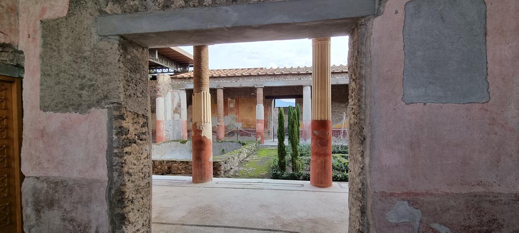 VI.9.6 Pompeii. December 2023.
Looking south through doorway to room 6, entrance to peristyle on south side of room 4. Photo courtesy of Miriam Colomer.