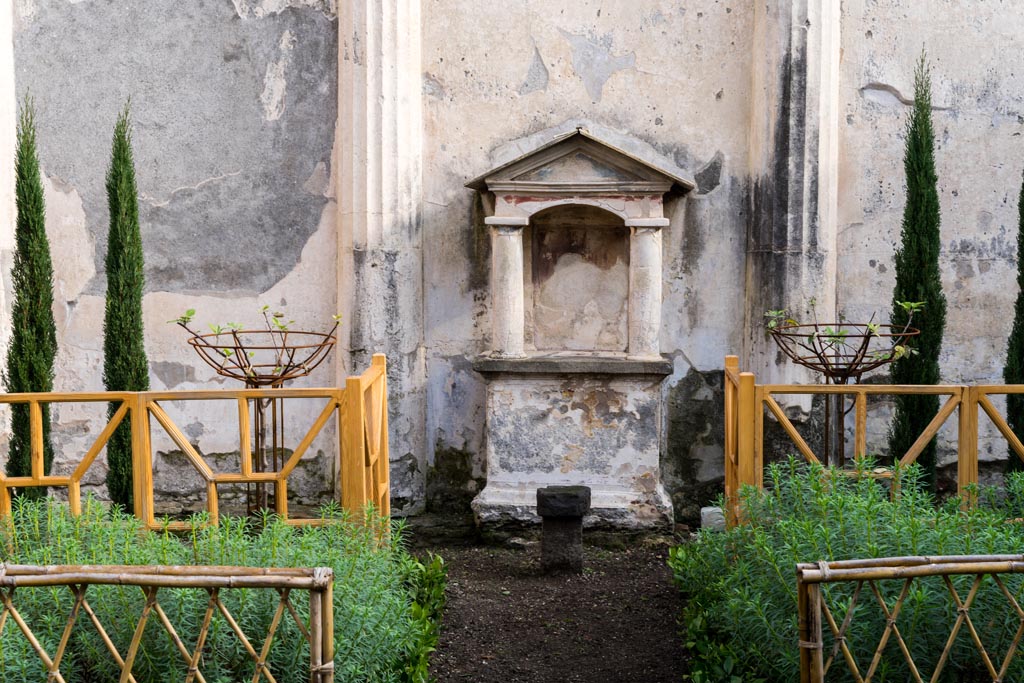 VI.9.6 Pompeii. January 2023. Room 17, lararium against east wall of pseudo-peristyle. Photo courtesy of Johannes Eber.
The fences and cypress grove planting reflect the original painting on the east wall as shown by Gell, above.