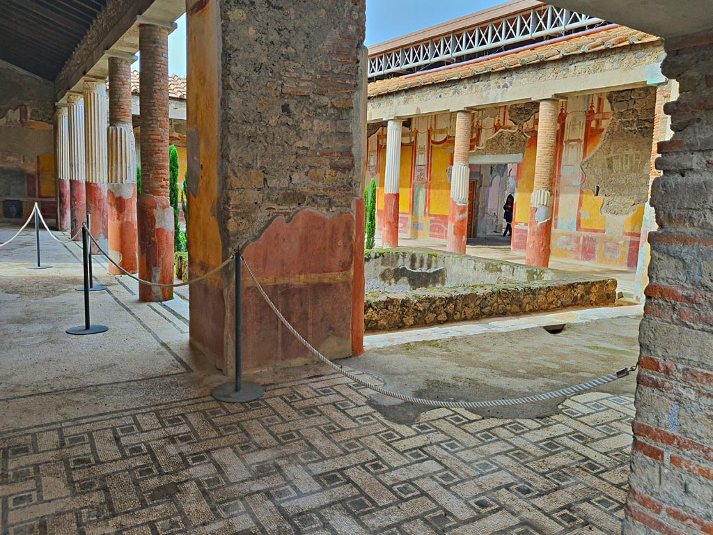 VI.9.6 Pompeii. November 2023.
Room 6, looking west across east portico towards pilaster in south-east corner. Photo courtesy of Giuseppe Ciaramella.