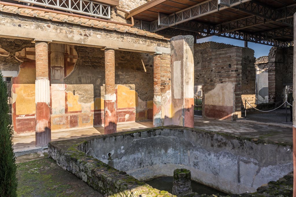 VI.9.6 Pompeii. January 2023.
Room 6, looking north-east across deep pool towards north end of east wall of peristyle, on right. Photo courtesy of Johannes Eber.