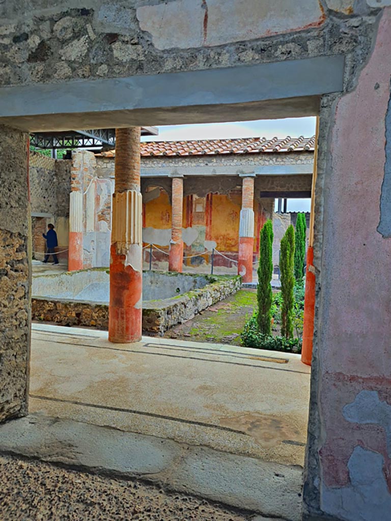 VI.9.6 Pompeii. November 2023.
Doorway to room 6, entrance to peristyle on south side of room 4, the vestibule in atrium. Photo courtesy of Giuseppe Ciaramella.