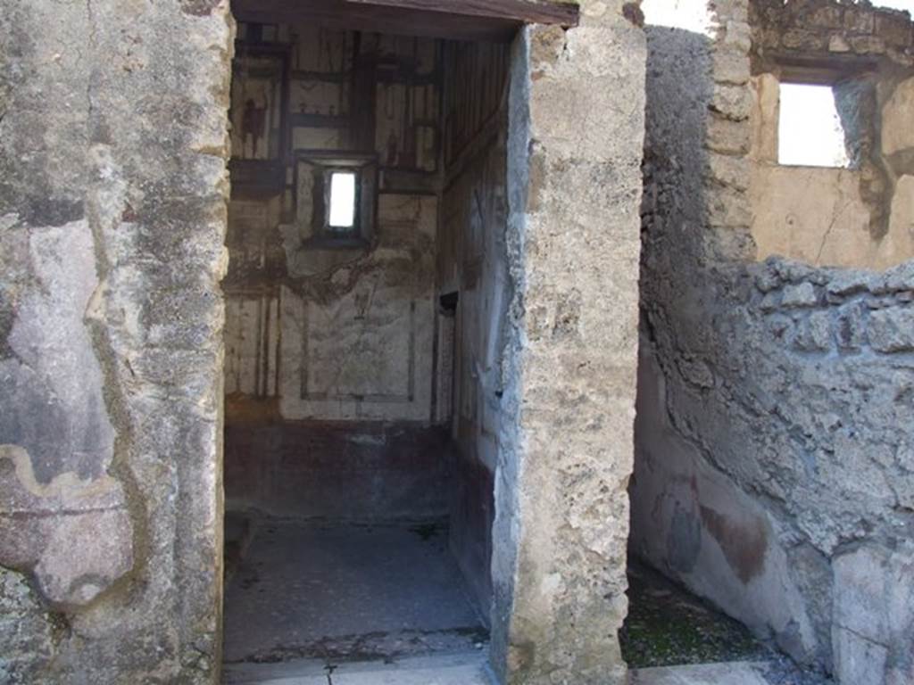 VI.9.6 Pompeii. March 2009. Doorways to rooms 16 and 15, on west side of atrium.