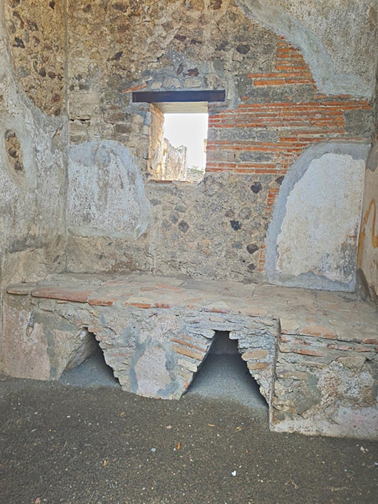 VI.9.7 Pompeii. November 2023.
Room 4, hearth in kitchen against west wall. Photo courtesy of Giuseppe Ciaramella.
