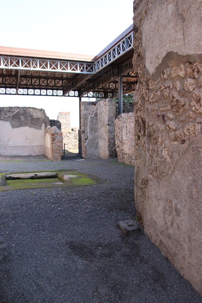 VI.9.7 Pompeii. October 2022.
Room 2, looking south-east across atrium towards south-east corner with doorway to room 8 and corridor 11.
Photo courtesy of Klaus Heese.