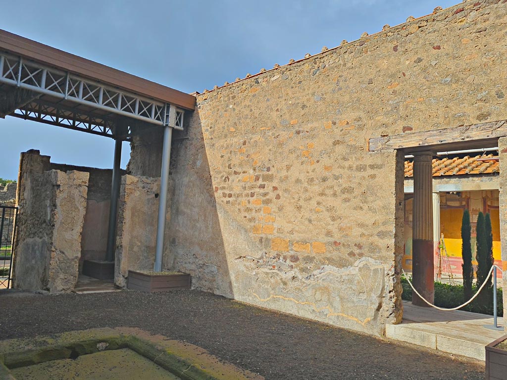 VI.9.7 Pompeii. November 2023. 
Room 2, looking north-west across atrium towards doorway to room 3, on left and to atrium of VI.9.6, on right.
Photo courtesy of Giuseppe Ciaramella.
