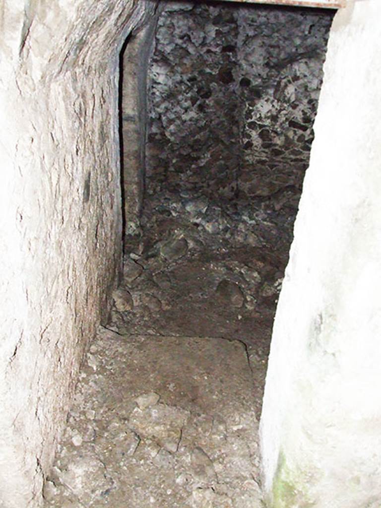 VI.9.10 Pompeii. March 2009.
Doorway to second underground room, looking west from corridor. The doorway to third room can be seen in the room on the left.