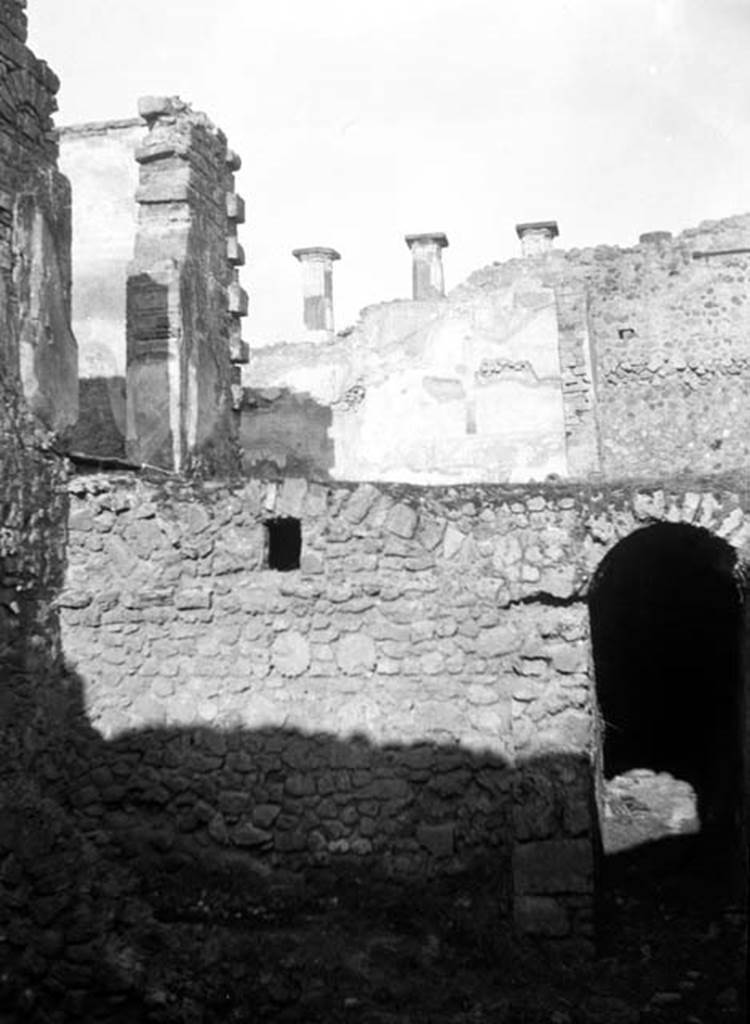 230881 Bestand-D-DAI-ROM-W.729.jpg
6.9.10 Pompeii. W729. Looking north towards entrance to corridor and underground kitchen, on lower level. On the left of the upper level are the doorways from the tablinum 26 and triclinium 27 onto the portico and peristyle at 29/30. Taken from rear of 6.9.5.
Photo by Tatiana Warscher. With kind permission of DAI Rome, whose copyright it remains.
See http://arachne.uni-koeln.de/item/marbilderbestand/230881