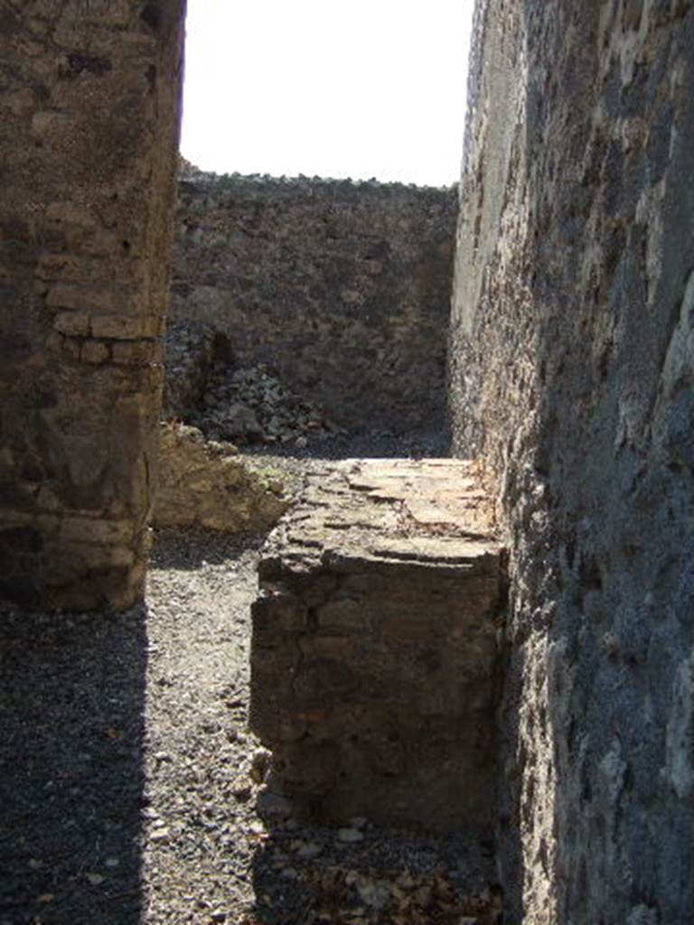 VI.9.12 Pompeii. September 2005. Looking west towards room 37, kitchen at front, and storeroom 36, at rear.