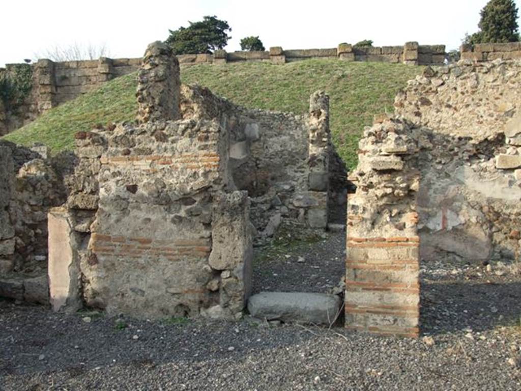 VI.9.14 Pompeii. December 2007. Doorway to corridor 29 leading to kitchen 28, in north-east corner of atrium. According to Garcia y Garcia, two bombs fell in this combined house, (VI.9.1 and 14) one fell on the area to the north-west of the atrium of VI.9.1.
The other fell on this north-east part of the house. All the area was then left abandoned and semi-derelict for quite a time.
See Garcia y Garcia, L., 2006. Danni di guerra a Pompei. Rome: L’Erma di Bretschneider. (p.77)