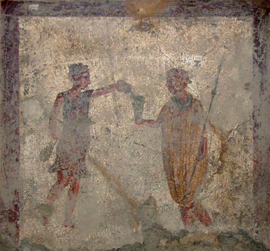 VI.10.1 Pompeii. May 2003. Fresco on north wall of rear room. A soldier with spear in his left hand holds out his cup to a slave.
Photo courtesy of Nicolas Monteix.